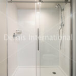Cultured marble shower pan and Glass shower doors
